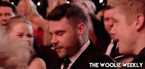 Man In Suit And Tie In Crowd GIF