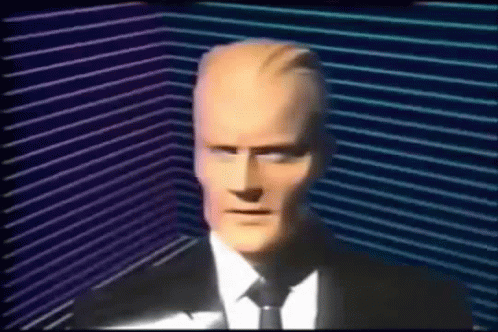 Man In Suit And Tie In Dark Room GIF