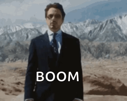 Man In Suit And Tie In Desert With Boom GIF