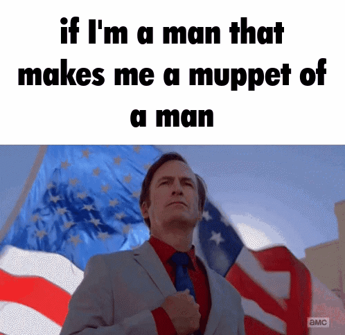 Man in Suit and Tie in Front of American Flag With Fist in Pocket