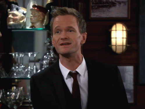 Man In Suit And Tie In Front Of Bar GIF