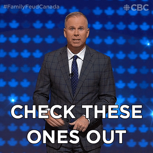 Man in Suit and Tie in Front of Blue Background Says Check These Ones Out