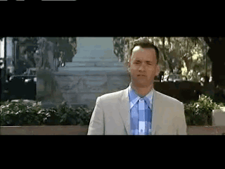 Man in Suit and Tie in Front of Building