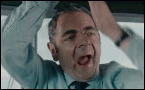 Man In Suit And Tie In Front Of Castle GIF