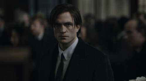 Man In Suit And Tie In Front Of Crowd GIF