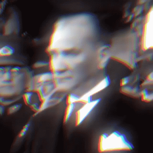Man in Suit and Tie in Front of Crowd