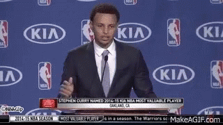 Man in Suit and Tie in Front of Kia Logo