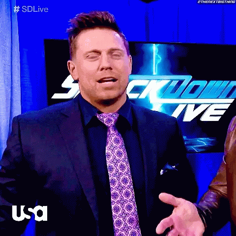 Man in Suit and Tie in Front of Sdlive Sign