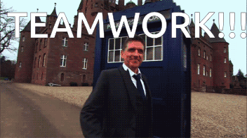 Man In Suit And Tie In Front Of Teamwork Box GIF