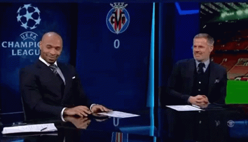 Man in Suit and Tie in Front of UEFA Logo