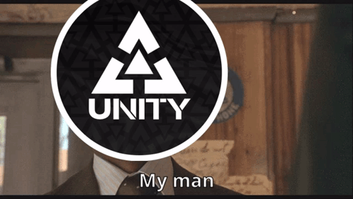 Man in Suit and Tie in Front of Unity Logo