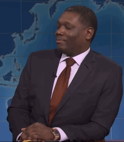 Man In Suit And Tie In Front Of World Map GIF