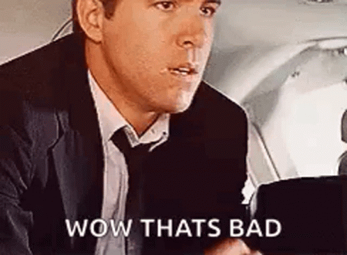 Man In Suit And Tie In Plane Back Seat GIF