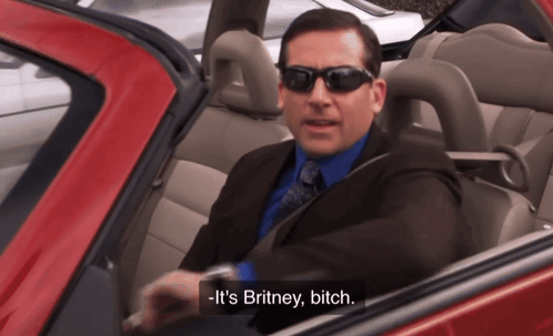 Man in Suit and Tie in Red Car Says Britney Bitch