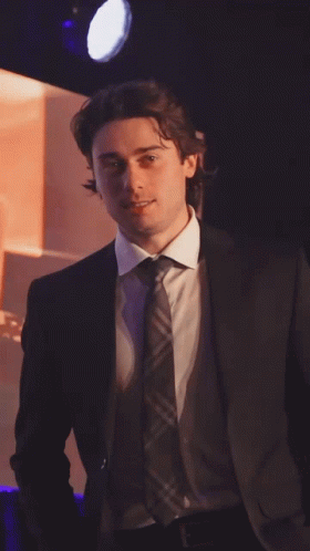 Man in Suit and Tie in Spotlight