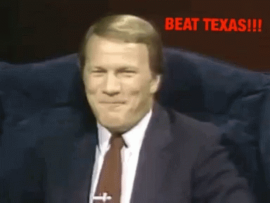 Man in Suit and Tie Laughing Beat Texas