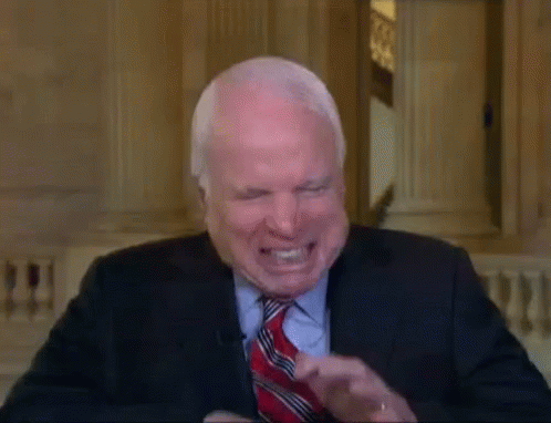 Man in Suit and Tie Laughing
