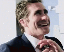 Man in Suit and Tie Laughing Hands in Pockets