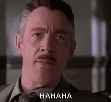 Man in Suit and Tie Laughing