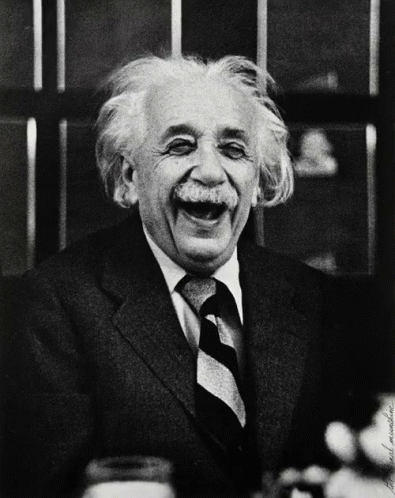 Man in Suit and Tie Laughing