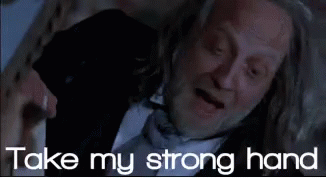 Man In Suit And Tie Laying Down Saying Take My Strong Hand GIF