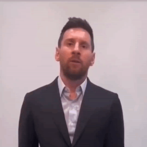 Man In Suit And Tie Looking At Camera GIF