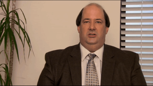 Man in Suit and Tie Looking at Camera