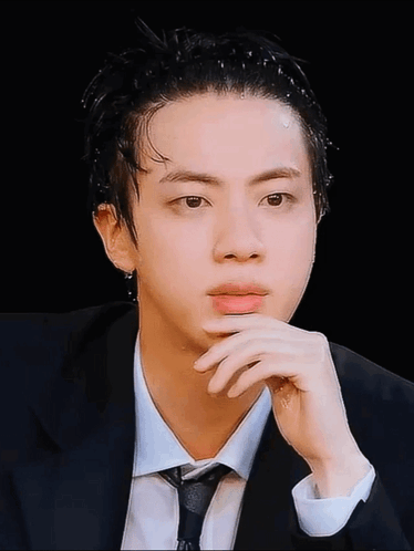 Man in Suit and Tie Looking at Camera
