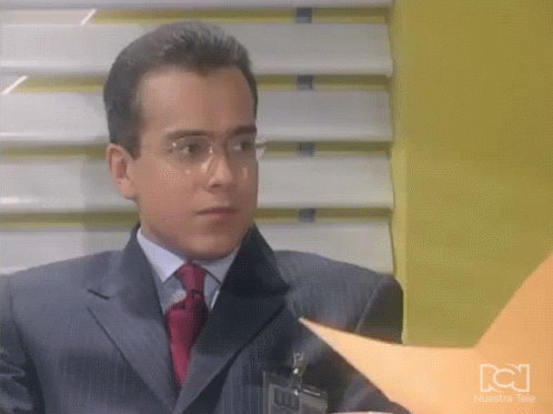 Man In Suit And Tie Looking At Paper GIF