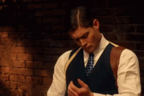 Man In Suit And Tie Looking Down GIF