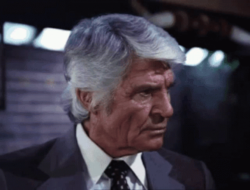 Man in Suit and Tie Looking Down
