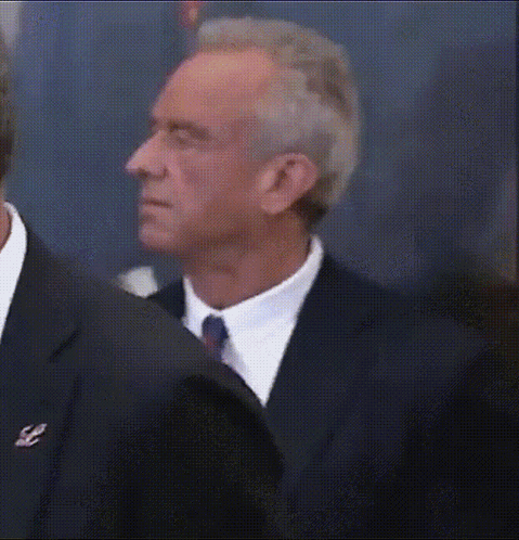 Man in Suit and Tie Looking Sideways