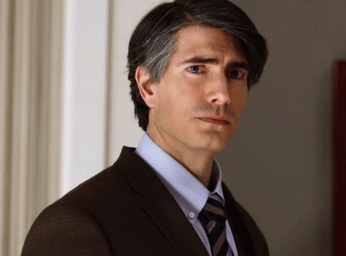 Man in Suit and Tie Looking Sideways