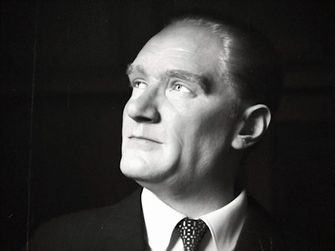 Man In Suit And Tie Looking Up At Sky GIF