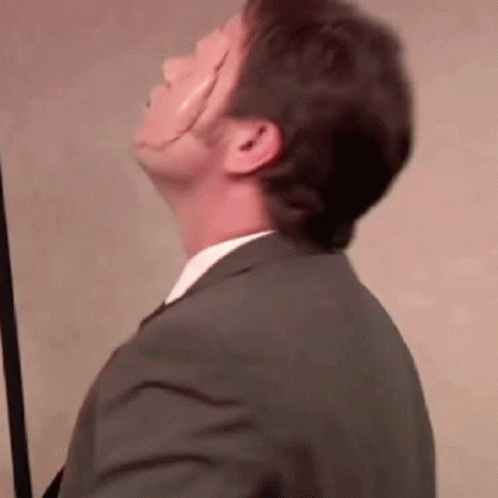 Man in Suit and Tie Looking Up