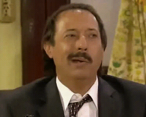 Man in Suit and Tie Making a Face