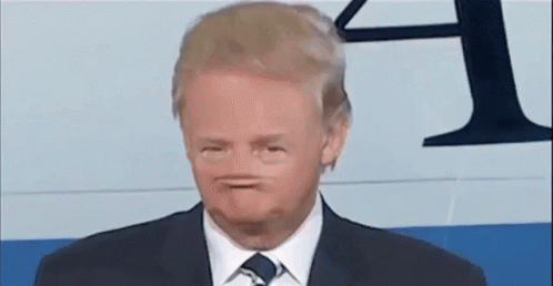 Man in Suit and Tie Making a Face