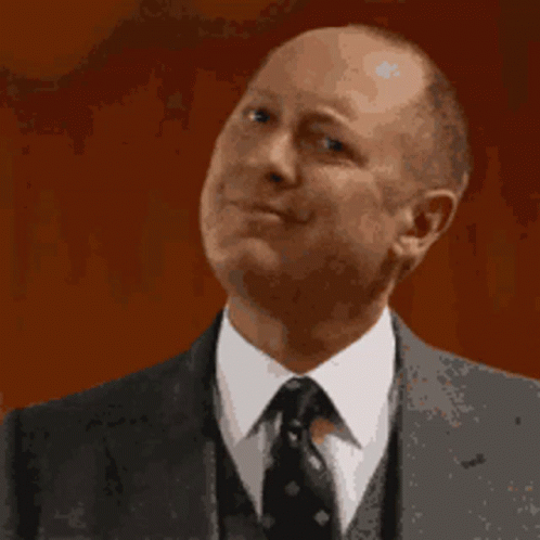 Man In Suit And Tie Making A Face GIF