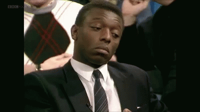 Man in Suit and Tie Making Face
