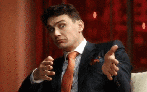 Man in Suit and Tie Making Face