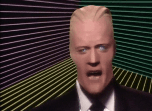 Man In Suit And Tie Making Funny Face GIF