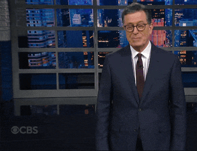 Man in Suit and Tie Making Funny Face at CBS Screen