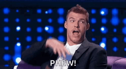 Man In Suit And Tie Making Funny Face GIF