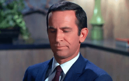 Man in Suit and Tie Making Funny Face