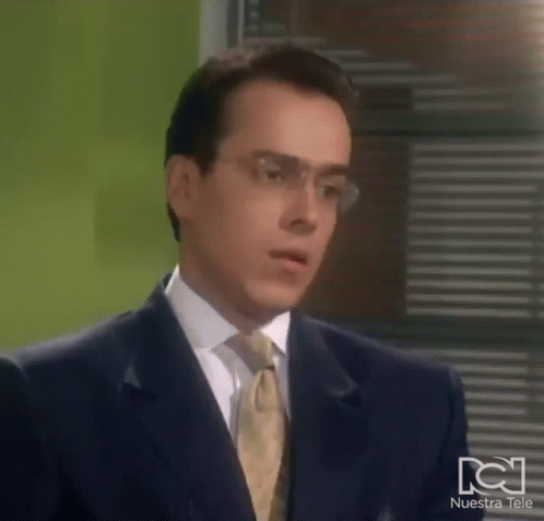 Man In Suit And Tie Making Funny Face With Glasses GIF