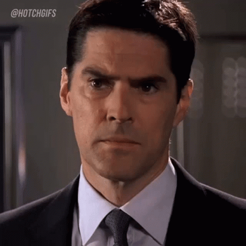 Man in Suit and Tie Making Serious Face
