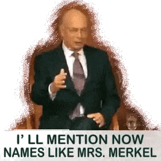 Man in Suit and Tie Mentioning Merkel