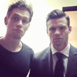 Man In Suit And Tie Next To Another Man GIF