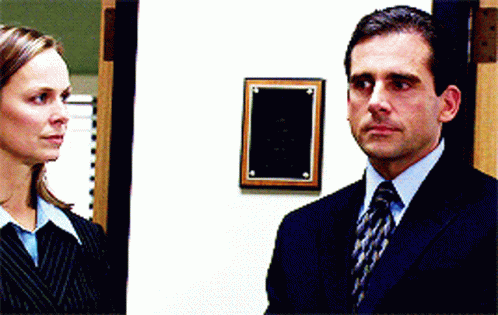 Man in Suit and Tie Next to Woman