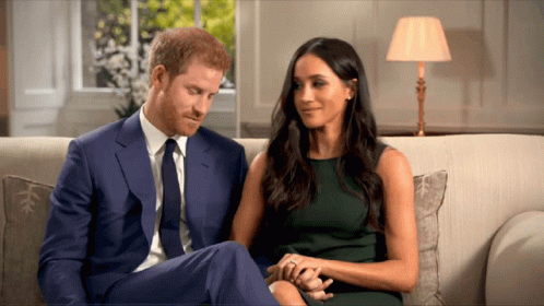 Man in Suit and Tie Next to Woman in Green Dress